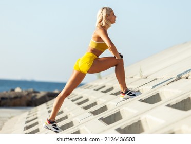 Athletic Woman Exercising From A Concrete Surface On The Beach. Fitness, Outdoor Aerobics Concept