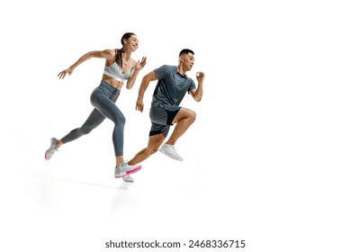 Athletic woman and man dressed fashion sportswear running side by side against white studio background with copy space. Concept of people in sport, healthy lifestyle, teamwork, motivation. Ad - Powered by Shutterstock