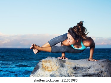 Athletic Woman Practicing Yoga Outdoors