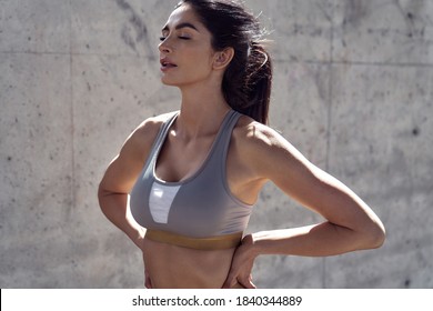 Athletic woman resting after exhausting running workout