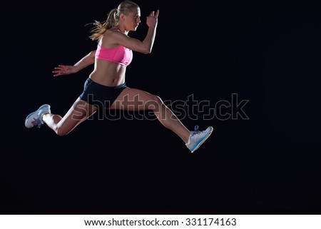 Similar – One young middle age athletic, woman training, exercising with fitness jumping rope over dark background, full length front view, looking at camera