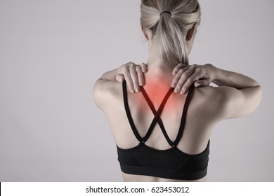 Athletic Woman Suffering From Back Pain . Pain Relief, Chiropractic Concept. Sport Exercising Injury