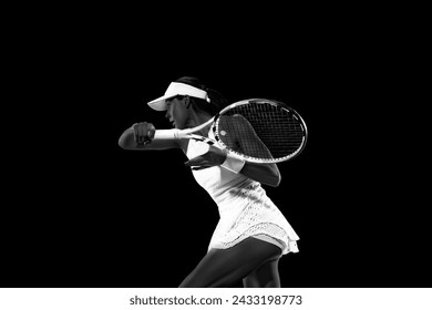 Athletic woman in tennis attire playing backhand against black studio background. Monochrome filter. Concept of women in sport, active lifestyles, tournaments and events, energy, movement. - Powered by Shutterstock