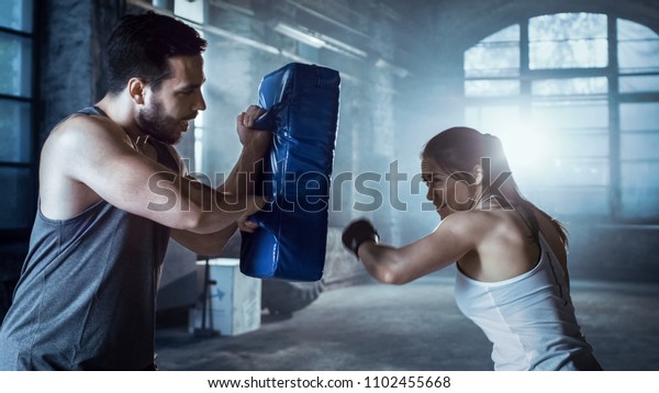 Athletic Woman Trains Her Punches On Stock Photo (Edit Now) 1102455668