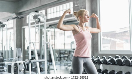 Athletic women exercise at home during coronavirus outbreak. Caucasian girl workout at home. Concept of health care, home quarantine, physically strong, fit, and active. - Shutterstock ID 1722428512