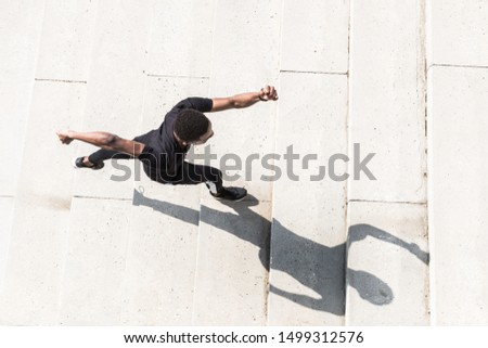 Similar – Athletic man warming up before running.