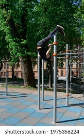 Athletic Young Man With Artificial Leg Working Out On A Bars