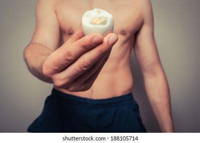 Athletic Young Man Is Holding A Hard Boiled Egg