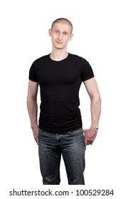 Athletic Young Man In Jeans And T-shirt Isolated On White Background