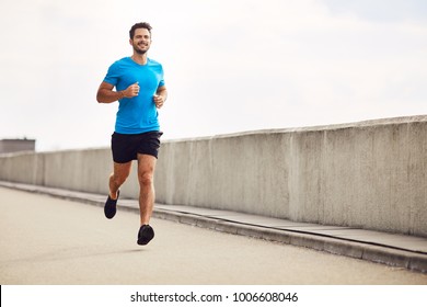 Athletic young man running