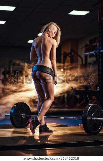 Topless girls weightlifting