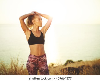 Athletic young woman exercising outdoors