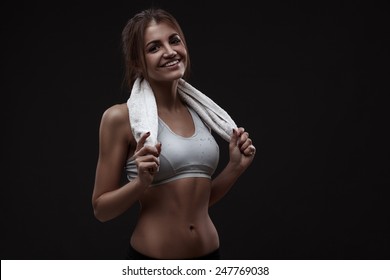 Athletic Young Woman Isolated Over Dark Background