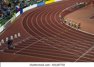 Athletics professional race on long distance. African Athletes are running on stadium before olympic game in Rio.