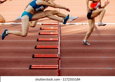 Athletics Women 100 Metres Hurdles Running In Stadium