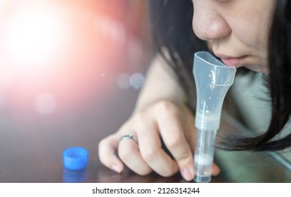 ATK Antigen test kit for COVID-19 saliva SARS CoV coronavirus at home. Kid Patient spit saliva for testing before back to school. People healthcare concept. - Shutterstock ID 2126314244