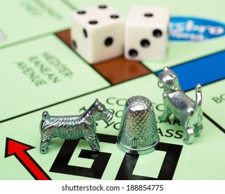 ATLANTA - APRIL 23, 2014: Close Up Of Monopoly Game Pieces On Board.