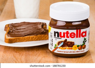 ATLANTA - APRIL 23, 2014: Jar Of Nutella, Toast With Nutella Spread And Milk To Drink. 