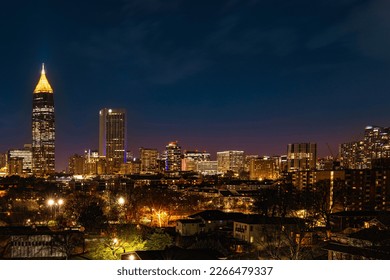 Atlanta City Skyline at Night with Skyscrapers and Buildings at Cloudy Twilight over the Trees in Georgia - Powered by Shutterstock