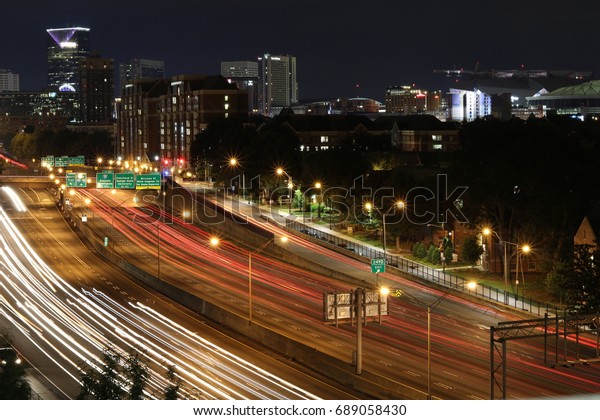 Atlanta cityscape with\
blurred car lights