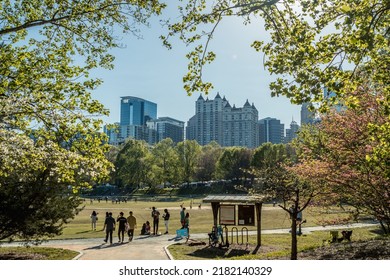 Atlanta, GA USA– April 10 2022: A View Of The Midtown Atlanta Skyline From The Nostalgic Piedmont Park Showing People During The Dogwood Festival.