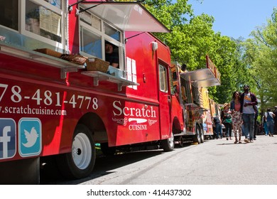 ATLANTA, GA - APRIL 16:  People Walk Among 30 Food Trucks Lined Up In Grant Park At The Food-o-rama Festival On April 16, 2016 In Atlanta, GA.