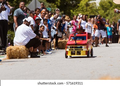 ATLANTA, GA - AUGUST 13: A Kid Steers His Homemade Car Downhill In The Cool Dads Rock Soap Box Derby In The Old Fourth Ward, On August 13, 2016 In Atlanta, GA.