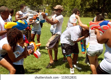 ATLANTA, GA - JULY 28:  Unidentified People Take Part In A Water Gun Battle Called The Fight4Atlanta, A Squirt Gun Fight Between Dozens Of Locals At Freedom Park On July 28, 2012 In Atlanta.