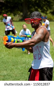 ATLANTA, GA - JULY 28:  Unidentified People Take Part In A Water Gun Battle Called The Fight4Atlanta, A Squirt Gun Fight Between Dozens Of Locals At Freedom Park On July 28, 2012 In Atlanta.