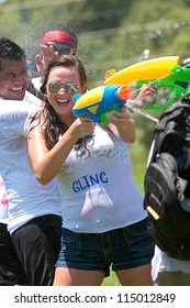 ATLANTA, GA - JULY 28:  Unidentified People Take Part In A Water Gun Battle Called The Fight4Atlanta, A Squirt Gun Fight Between Dozens Of Locals At Freedom Park On July 28, 2012 In Atlanta.