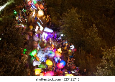 ATLANTA, GA - SEPTEMBER 10:  Motion blur of people walking with lanterns at night along the Beltline in the annual Atlanta Lantern Parade in the Old Fourth Ward, on September 10, 2016 in Atlanta, GA.