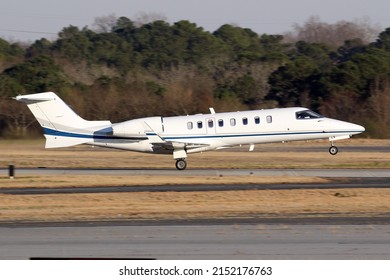 Atlanta, GA, USA - 03 March 2022:  Bombardier Learjet 45 Private Jet Aircraft, Taking off from Peachtree Dekalb Airport, Atlanta, GA.