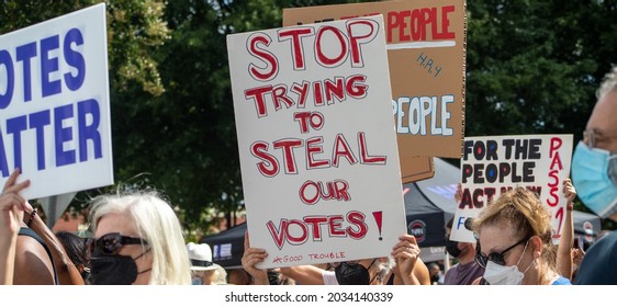 Atlanta, GA USA Aug 28, 2021 Person holding "Stop Trying to Steal on Votes" sign at the March  for Voting Rights Rally