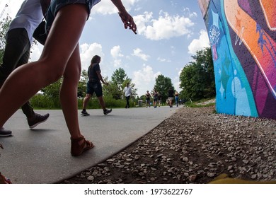 Atlanta, GA USA - July 6 2019:  Low-angle view of people walking along the public recreational space of the Atlanta Beltline near the Old Fourth Ward Park, on July 6, 2019 in Atlanta, GA. 