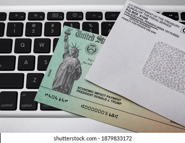 ATLANTA, GEORGIA - December 21, 2020 : United States Treasury Economic Impact Check Including President Donald J. Trump Printed Name. Stimulus Check For Coronavirus COVID-19 Pandemic Relief.