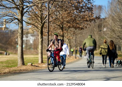 ATLANTA, GEORGIA - FEBUARY 11, 2022: The Atlanta Beltline offers many fun activities like walking, jogging, bike and electric-scooter riding.