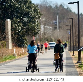 ATLANTA, GEORGIA - MARCH 6, 2022: The Atlanta Beltline is excellent for walking, skating, riding electric skate boards and scoters to witness the scenic views that Atlanta has to offer.