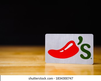 ATLANTA, GEORGIA - OCTOBER 15, 2020 : Chili's Bar & Grill Gift Card. Chili’s Is An American Casual Dining Restaurant Founded By Larry Lavine In Texas In 1975.