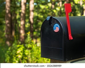 ATLANTA, GEORGIA - OCTOBER 3, 2020 : I Voted Sticker On A U.S. Postal Service Residential Mailbox. Absentee Voter Vote By Mail.