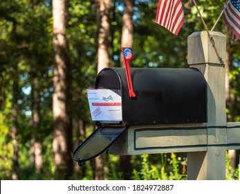 ATLANTA, GEORGIA - SEPTEMBER 30, 2020 : Absentee Voter Vote By Mail Ballot In U.S. Post Office Residential Mailbox.