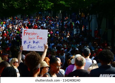 Atlanta, Georgia / United States - July 4 2018: A Fan Holds A Wonderfully Stated Sign At The Atlanta Peachtree Road Race.