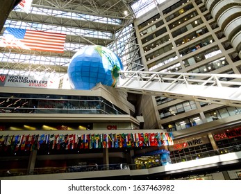 Atlanta, Georgia / USA - August 20 2012: Interior Atrium Of CNN's Multi-story World Headquarters, A Popular Tourist Attraction, Showing Flags Of The World And A Long Escalator Leading To A Large Globe