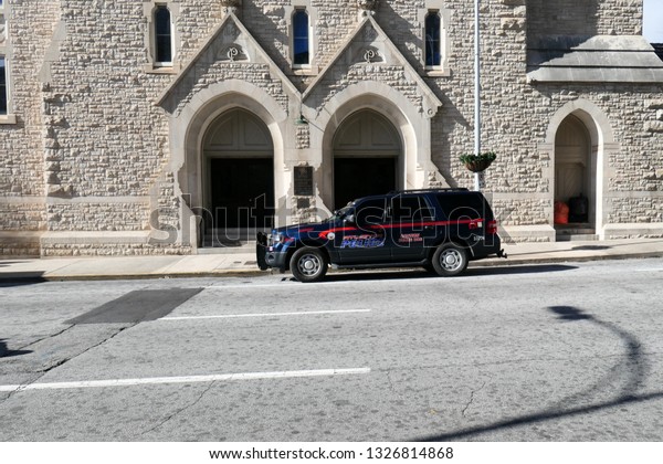 Atlanta, Georgia / USA - January 22, 2019:  An Atlanta\
Police Department Car with Caution Police Dog sign parked in front\
of the Central Presbyterian Church at 201 Washington St SW,\
Atlanta, GA