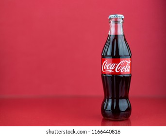 Atlanta, Georgia, USA - July 22, 2018: rare red coca-cola contour bottle on red background