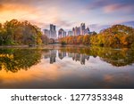 Atlanta, Georgia, USA Piedmont Park skyline in autumn on Lake Meer at dusk.