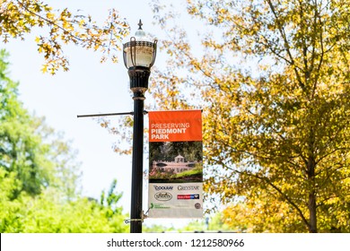 Atlanta, USA - April 20, 2018: Piedmont Park In Georgia Capital Urban City Downtown, Sign For Preserving, Conservancy On Lamp Lantern Post Pole