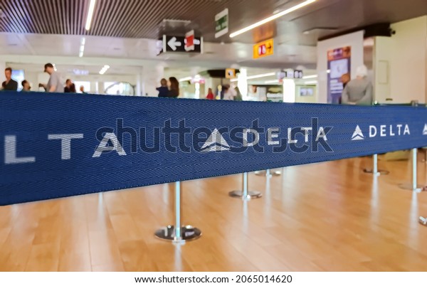 Atlanta, USA, July 2019: blue ribbon barrier with\
the Delta airlines logo. Delta is one of the major airlines of the\
United States