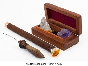 Atlantean Stick And Wooden Pendulum For Dowsing. Wooden Box For Storing Stones And Mineral Stones For Dowsing. White Brackground.