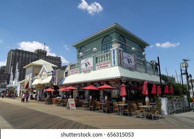 ATLANTIC CITY, NEW JERSEY - JUNE 12, 2016: Atlantic City Boardwalk. Restaurants and gift shops on the boardwalk. Editorial use only.                                