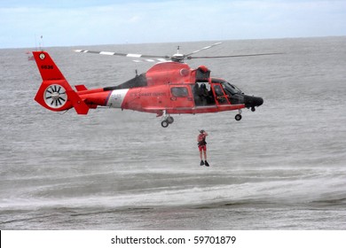 ATLANTIC CITY, NJ - AUGUST 24:  US Coast Guard HH-65A Dolphin Helicopter Drops Rescue Diver During Rescue Exercise August 24, 2010 In Atlantic City,  New Jersey